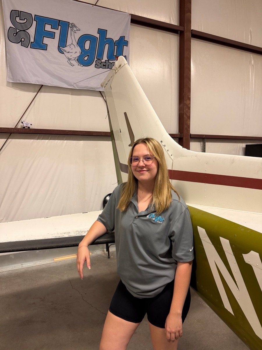 Cassidy Britt, Certified Flight Instructor at SG Flight School, in the hangar at Falcon Field